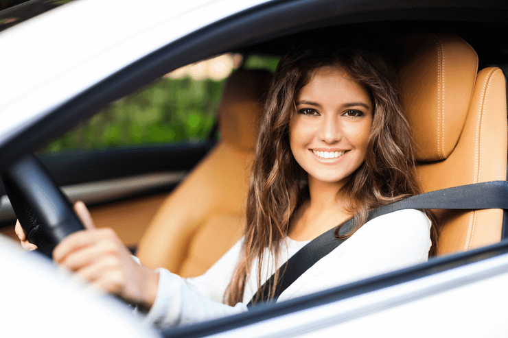 A satisfied woman in a car