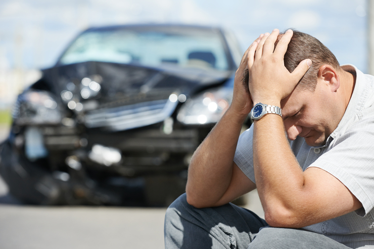 A man with his broken car