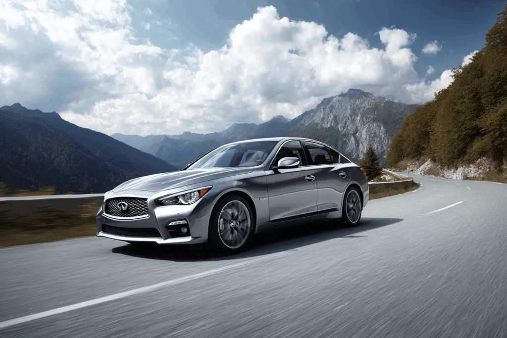 Silver Infiniti Q50 on a mountain road.